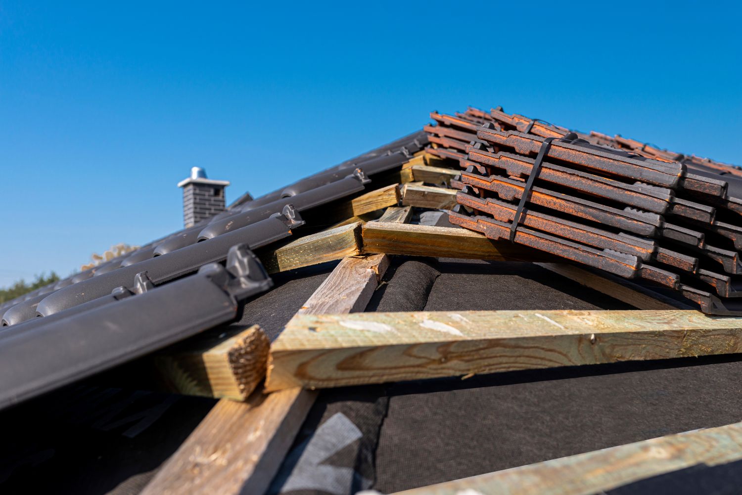 Residential gutter and downspout system being inspected